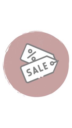 a pink circle with the word sale written on it and two white tags in front of it