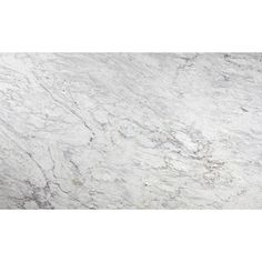 a white marble counter top with grey veining