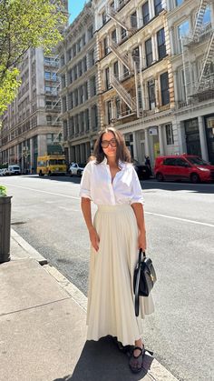 It takes a village 🤡 . . . . . Summer outfits, spring outfit ideas, outfit ideas, Pinterest girl, ootd, outfit inspo, nyc style #outfitideas #styleinspo #outfitgoals #nycblogger Pleated skirt #Regram via @www.instagram.com/reel/C69ElDNsut2/ Cream Long Skirt Outfit, Trending Skirt Outfits, Cute Maxi Skirt Outfits, Ootd With Skirt, Cream Pleated Skirt Outfit, How To Style A Maxi Skirt, Maxi Pleated Skirt Outfit, Pleat Skirt Outfit, Styling Pleated Skirt