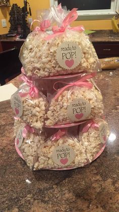 three bags filled with popcorn sitting on top of a counter