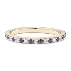 a yellow gold band with blue and white diamonds