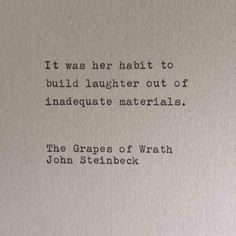 an old typewriter with the words it was her habit to build laughter out of landscape materials