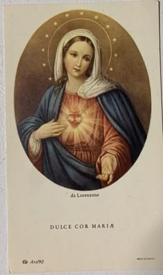 an image of the virgin mary holding a star in her right hand and wearing a blue robe