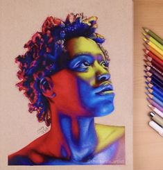 a drawing of a man's face with colored pencils next to it