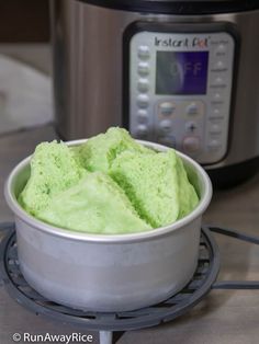 a bowl filled with green ice cream next to an instant pot