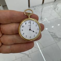 Brand: Tiffany & Co.  Gender: Unisex  Metal Type: 18K Yellow Gold  Diameter: 33.00 mm  Weight: 31.64 grams  18K Yellow Gold Swiss made pocket watch with original box. The metal was tested and determined to be 18K yellow gold. Engraved with "18K". The "Tiffany & Co." trademark (or hallmark) can also be found on the item. In excellent condition.  Vintage. Signs of wear are consistent with age.  18K Yellow Gold Pocket Watch  Watch Properties  Family: 18K Yellow Gold Pocket Watch Model: 18K Yellow Gold Pocket Watch Serial No.: 81341  Caliber Properties  Caliber No.: 81336 Movement Type: Manual Display: Analog  Case Properties  Material(s): 18kt Yellow Gold Glass Type: Sapphire Crystal Case Back: Closed Case Shape: Round Diameter: 33.00 mm  Dial Properties  Color: White Index Type: Arabic H Gold Timeless Chronometer Watch Accessories, Luxury Yellow Gold Pocket Watch With Chronometer, Luxury Gold Pocket Watch With Chronometer, Elegant Yellow Gold Pocket Watch For Evening, Formal Yellow Gold Medallion Watch, Luxury Formal Pocket Watch With Chronometer, Luxury Chronometer Pocket Watch For Formal Occasions, Elegant Self-winding Pocket Watch With Round Dial, Elegant Self-winding Pocket Watch