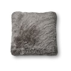 a gray pillow with fluffy fur on it's sides and a square shape in the middle