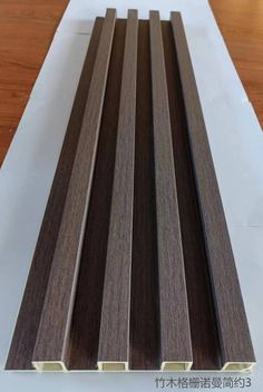 some brown and white wood planks on top of a table