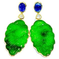 Bochic "Orient” Jade & Sapphire Earrings set in 22K Gold & Silver Green Carved Jade - 30 carats in total Natural Deep Blue Sri Lankan Sapphires Shape - Cabochon 14 Carats Natural White Topaz - 5 carats in total Shape - Trillion Set in 22K Gold and Silver 950 This Earrings are perfect to wear day to night A perfect cross between fashion, swim wear to evening wear. You'll steal the show with this spectacular vintage "Orient” style jade earrings. Oval cabochon Blue sapphires of nearly fourteen cara Blue Sapphire Earrings, Carved Jade, Jade Earrings, Jade Carving, Sapphire Earrings, Oval Cabochon, Silver Wedding, 22k Gold, White Topaz