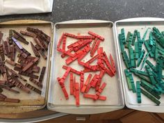 three trays filled with different colored sticks