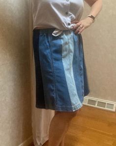 This is a one of a kind homemade denim blue jean leg panel skirt. I used the bottoms from 3 pairs of cotton jeans in different washes, light, medium and dark, reworking them and upcycling them making an eight section paneled skirt in 3 tones.  I washed the jeans in fragrance free soap before working with them. I cut eight panels from the legs, flaring them out slightly at the hem. I kept the jean hems intact for their style and character. The seams are done with a serger so they won't unravel. The waistband is elastic.  This is a medium to large fit skirt, depending on where you wear it on your waist. The unstretched length of the waist is about 16.5  inches across (33 doubled). The hip measurement is about 23" wide. (46) Length is about 20". If you'd like a similar but larger or smaller s Denim Patchwork Jeans, Repurposed Denim, Panel Skirt, Fit Skirt, Pink Seersucker, Boho Denim, Hi Fashion, Paneled Skirt, Denim Blue Jeans