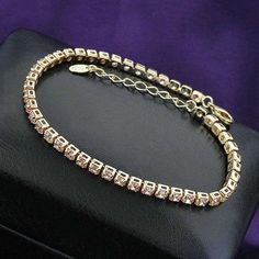 Pictures can't capture the true look. They have an intense sparkle and fire like genuine diamonds. All are prong set, not glued in. It is made out of 316L stainless steel and features 14K Gold IP Plating. It is the best kind of plating available. This bracelet features a triple locking clasp system just like on high-end jewelry. You get the look and feel of something that costs thousands at a much lower price. Order yours today! Bracelet Tennis, Bracelets And Charms, Tennis Bracelet, Gold Gold, Crystal Bracelets, Silver Bracelets, Jewellery And Watches, Silver Color, Mens Bracelet