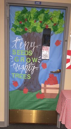 a door decorated with an apple tree and the words, every seeds grow through trees