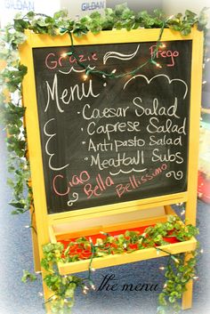 a menu board with plants growing on it