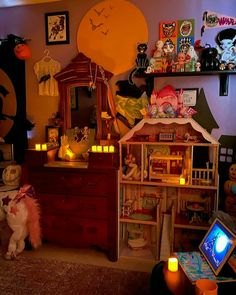 a room filled with lots of halloween decorations and toys on top of wooden dressers