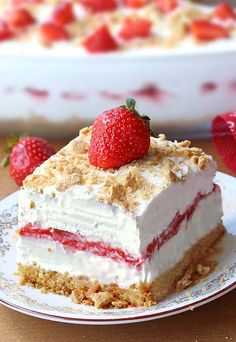 a piece of cake with strawberries on top