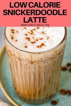 a close up of a drink in a glass on a plate with the words low calorie snickkerdoodle latte