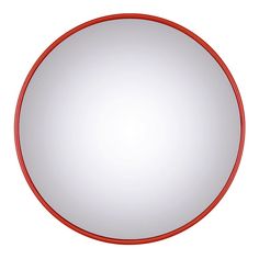 a round mirror with red trim around the edges