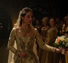 the tudors are getting ready to go into their wedding ceremony in period costumes and tiaras