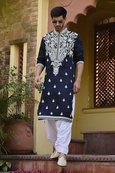 Navy blue kurta with kiran dori work in floral pattern. Paired with an ivory salwar. - Aza Fashions Dola Silk Kurta With Chikankari Embroidery And Traditional Drape, Chikankari Embroidered Kurta In Dola Silk With Traditional Drape, Chikankari Embroidery Dola Silk Kurta With Traditional Drape, Chikankari Embroidery Dola Silk Kurta, Chanderi Sherwani With Chikankari Embroidery For Navratri, Blue Chanderi Sherwani For Diwali, Traditional Wear With Resham Embroidery And Traditional Drape, Blue Dola Silk Kurta With Pallu, Blue Chanderi Sherwani With Zari Work