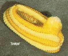 a knitted banana sitting on top of a carpet