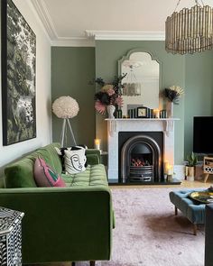 a living room filled with furniture and a fire place in front of a tv mounted on a wall