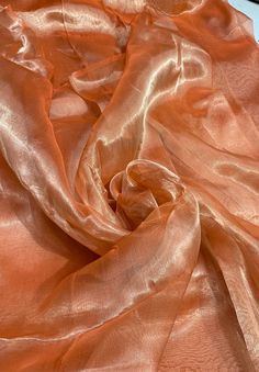 Metallic  tissue organza  Orange color  100% Silk Organza 45" wide. Usable for Apparel and interior designing. Silk Chiffon Fabric, Silk Route, French Silk, Peach Orange, Interior Designing, Organza Fabric, Orange Fabric, Silk Organza, Gorgeous Fabrics