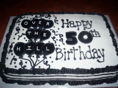 a white and black birthday cake with the words over the 80 on it's frosting