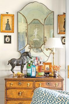 an antique dresser is adorned with antiques and decor