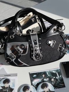 Please note that this product includes only one bag and one long strap. Alternative Style Satchel Shoulder Bag, Harajuku Style Tote Shoulder Bag With Adjustable Strap, Black Alternative Style Bags With Hardware, Black Gothic Bag With Hardware, Edgy Black Bag With Hardware Details, Edgy Black Bag With Hardware, Edgy Black Bags With Hardware, Gothic Bags With Zipper Closure For Concerts, Black Emo Bag For Concerts