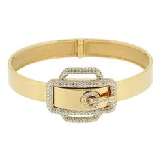 Here we have an elegant diamond bangle from the world renowned luxury designer, Hermès. A highly polished 18ct yellow gold bracelet plays host to belt buckle motif at the centre of the face which has been pavé set with 270 round brilliant cut diamonds and fitted with a push down clasp allowing the piece to easily and securely be opened and closed. A fabulously chic item, perfect for everyday wear and or special occasions. This bangle can be paireded with anything from jeans to an evening cocktai Diamond Belt, Modern Bracelets, Modernist Jewelry, Kelly Bag, Buckle Bracelet, Diamond Bangle, Yellow Gold Bracelet, Diamond Bracelets, Round Brilliant Cut Diamond