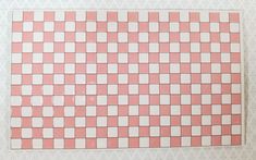 a piece of pink and white tile on the wall