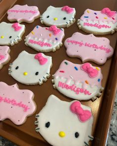 hello kitty decorated cookies are on a cookie sheet