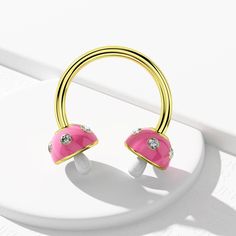 Description: Show off your love of mushroom fashions and bright colors whenever you wear this crazy adorable and dainty 16g horseshoe septum ring. It features a three-dimensional mushroom ends, with a baby pink mushroom umbrella embellished with micro CZ beads and a white mushroom stem. That's sure to put you in a sunny mood! Safe Material: High polished 316L stainless steel, which can be worn with ease and for a long time. This bar is internally threaded. Standard Size: The bar thickness is 16 Mushroom Stem, Mushroom Umbrella, Horseshoe Septum, White Mushroom, Pink Mushroom, White Mushrooms, Septum Clicker, Tragus, Baby Pink