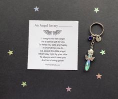 an angel keychain with a poem written on it next to stars and confetti