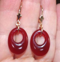 Quality 14K Genuine Red Jade Semi Roud Oval  Hoop Leverback Earrings You are buying a pair r of Vintage Old Stock High Polish Red Jade  hoops stones. These Red Jade  stones measure 20 mm x 15 mm. The whole earrings with leverbacks measures 35 mm. These are gorgeous. 5.6  Grams /  27.5  Carats Comfortable to Wear / Medium Size You will love wearing them. Red Hoop Pierced Jewelry, Red Pierced Hoop Jewelry, Red Hoop Pierced Earrings, Red Hoop Jewelry For Formal Occasions, Red Small Hoop Jewelry For Anniversary, Red Hoop Jewelry For Anniversary, Gift Oval Hoop Earrings With Lever Back, Elegant Small Hoop Red Earrings, Elegant Small Red Hoop Earrings