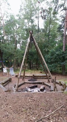 a fire pit in the middle of a forest