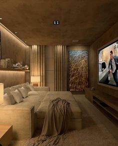 a living room filled with furniture and a flat screen tv mounted to the side of a wall