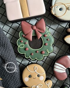 decorated cookies are arranged on a wire rack