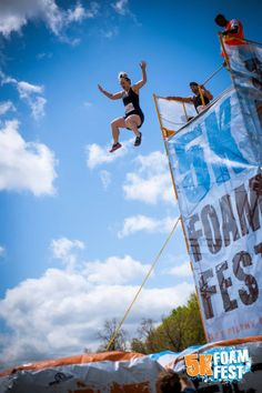 a man flying through the air while riding a skateboard on top of a ramp