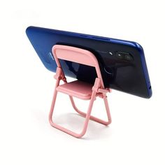 a pink and blue phone sitting on top of a small folding chair next to each other