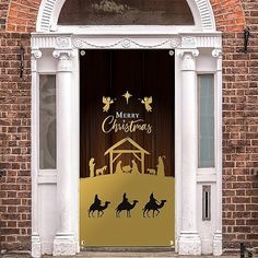 an open door with the nativity scene on it and christmas written in gold foil