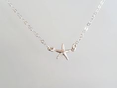 "Tiny starfish pendant. The sterling silver starfish charm is a dainty 9mm with a shiny finish. It has a delicate sterling silver chain and clasp. Shown here in 16\" length. *If you are unsure of the length you need, or would like to wear this item at different lengths, we now offer an adjustable length option! You can add an adjustable end to your necklace using this link: https://www.etsy.com/listing/791277751/necklace-extension-added-to-your Also available in 14k gold fill as seen in the last Sterling Silver Starfish Charm Necklace, Sterling Silver Starfish Necklace With Star Charm, Sterling Silver Necklace With Starfish Charm, Necklace Extension, Beach Items, Starfish Pendant, Starfish Necklace, Solid Gold Jewelry, Jewelry Cleaner