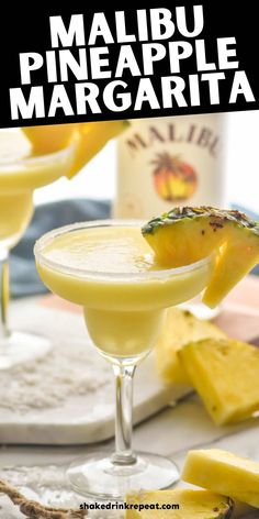 a pineapple margarita is garnished with sliced pineapple and served in coupe glasses