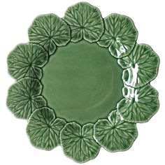 a green plate with leaves on it and the word love written in white letters above