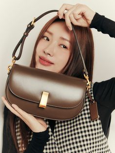 Editor's NotesJOY GRYSON's bag is good to be a point of look.- Luxurious design - Goes well with any outfits - Daily item- Voluminous shape- Moderate size- Feminine and minimal styleMeasurements(in.)- Size: 9.84 * 5.70 * 2.36 in.- Strap: 33.85 ~ 43.30 in.- Short Shoulder Strap: 19.88 ~ 23.03 in.Composition & Care- (Body) Italian cowhide (Lining) Microfiber- Avoid direct heat and moisture- Professional cleaning is recommendedDesigner- by JOY GRYSON Gold Light Luxury Shoulder Bag For Formal Occasions, Gold Light Luxury Formal Shoulder Bag, Designer Shoulder Bag With Gold-tone Hardware, Light Luxury Gold Shoulder Bag With Detachable Strap, Elegant Handheld Saddle Bag With Detachable Strap, High-end Brown Shoulder Bag With Gold-tone Hardware, High-end Baguette Bag With Gold-tone Hardware For Daily Use, Light Luxury Brown Shoulder Bag With Gold-tone Hardware, High-end Handheld Shoulder Bag With Gold-tone Hardware