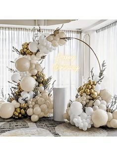 balloon arch with white and gold balloons