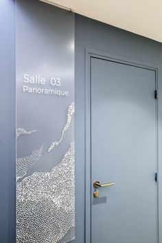 a blue door is in front of a glass sign that says sale 0 3 panoramique