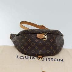 Brand: Louis Vuitton Model: Bum bag Color: Brown Material: Canvas Inclusions: dust bag Dimensions: W37cm x H14cm x D13cm Serial number: MI3118 Country of origin: France Condition: AB - good condition. The Louis Vuitton Monogram Bum Bag, made from Monogram Canvas in France, is a stylish shoulder bag that adds a touch of elegance to any outfit. It comes with a dust bag. While the exterior shows signs of usage with sunburn, stains, and slight rubbing on the shoulder strap and handle, as well as min Louis Vuitton Bum Bag, Stylish Shoulder Bag, Luxury Products, Bum Bag, Brown Canvas, Canvas Shoulder Bag, Bag Shoulder, New Bag, Monogram Canvas