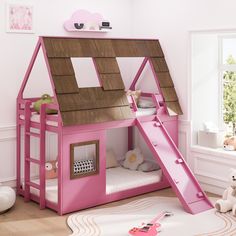 a child's pink bunk bed with a slide